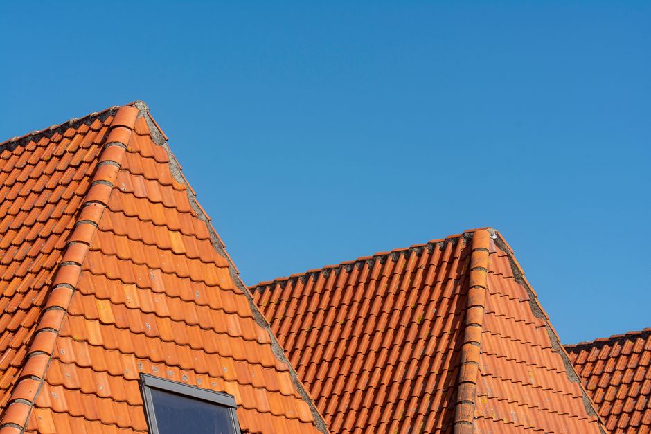 Cracked tile being replaced on a Tempe tile roof