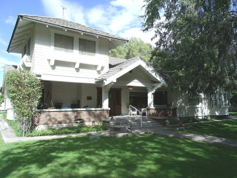 Residential home in the East Valley with roofline and gutters, illustrating gutter replacement cost factors for Mesa, Chandler, Gilbert and Scottsdale homeowners